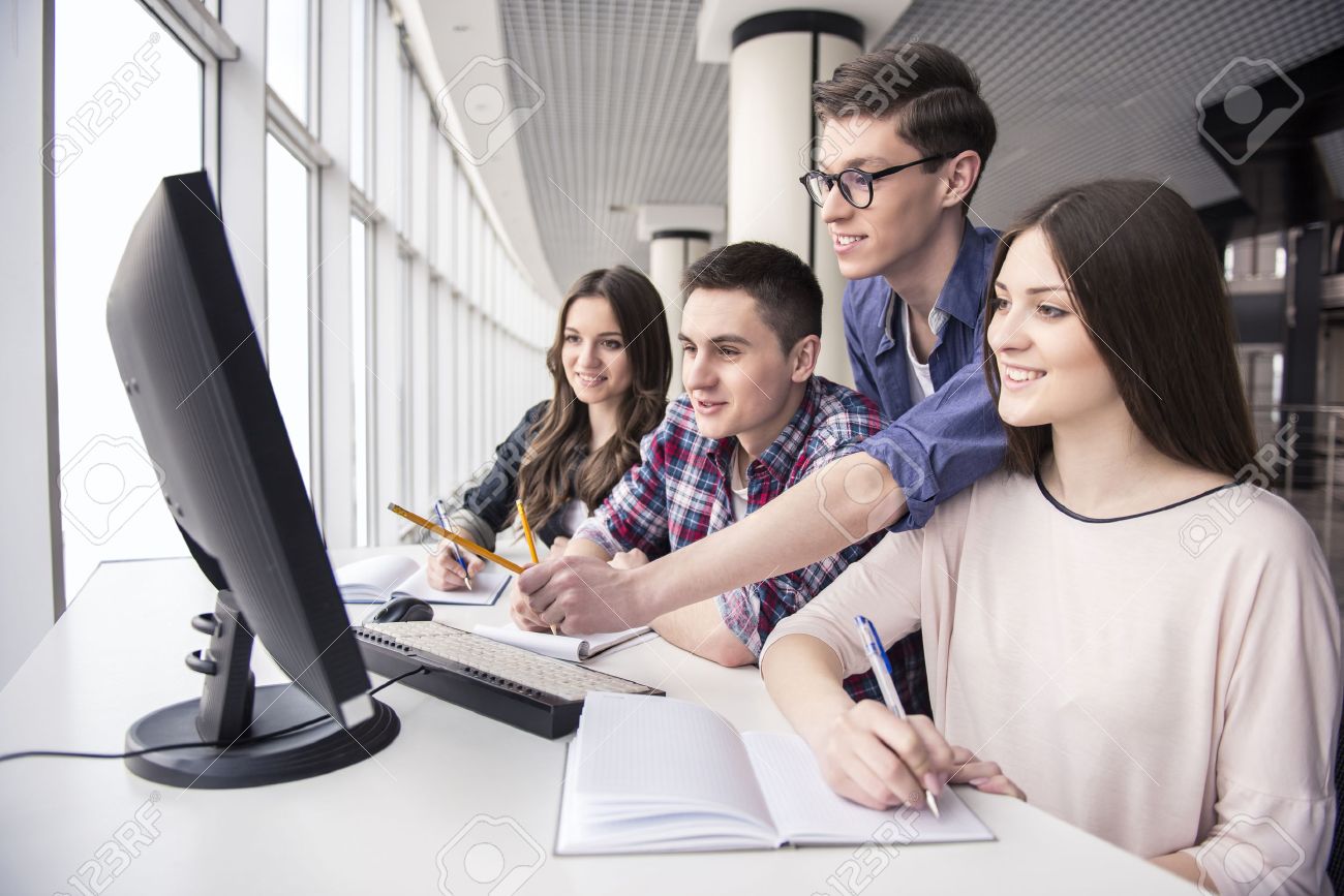 38294854 smiling students looking at computer pc at college